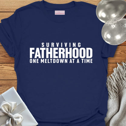 Surviving Fatherhood One Meltdown at a Time - Parenting T-Shirt