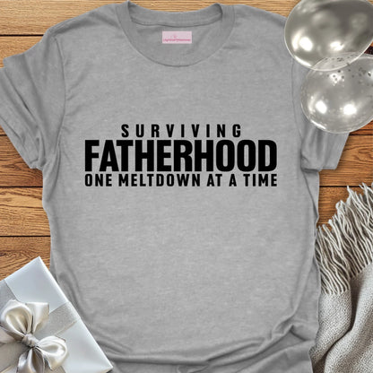 Surviving Fatherhood One Meltdown at a Time - Parenting T-Shirt